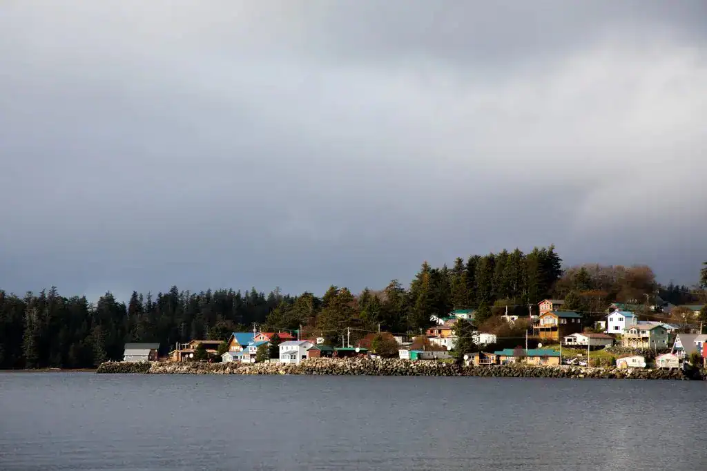 A town sits on the shore of a lake.